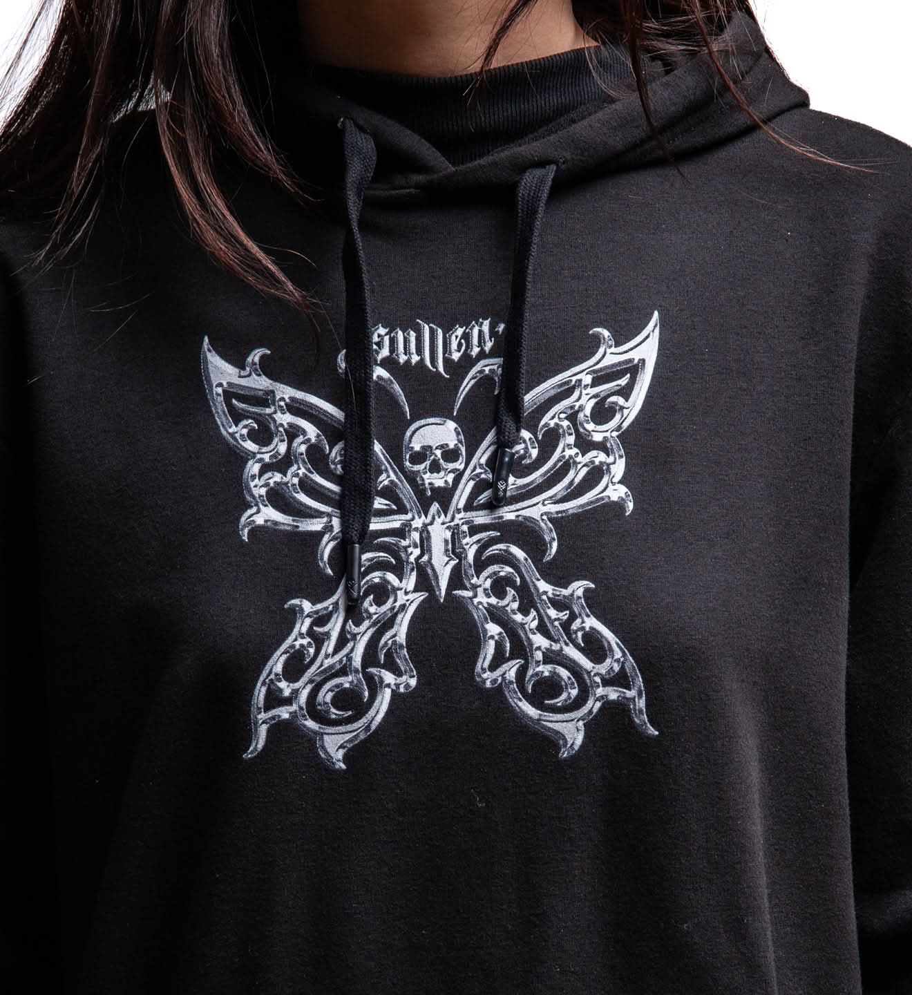 Black hoodie with a white butterfly design and text on a person wearing it.