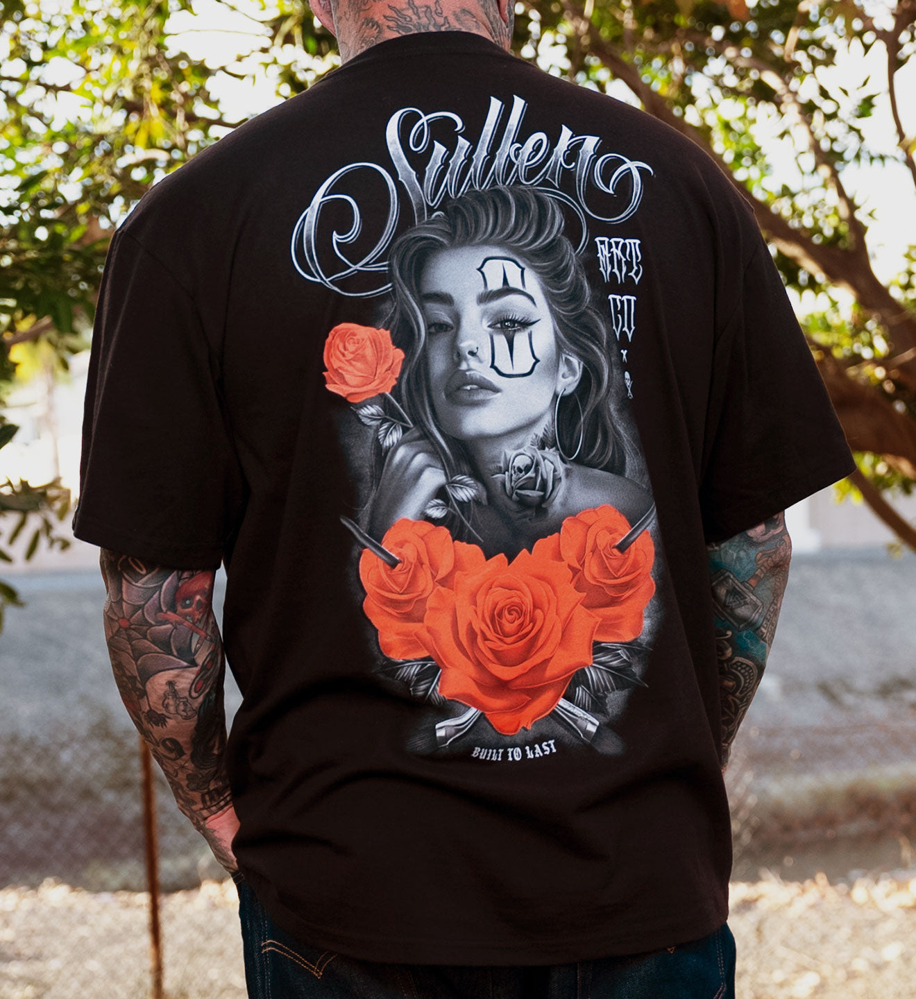 BLACK SULLEN T SHIRT WITH A WOMAN HOLDING A ROSE