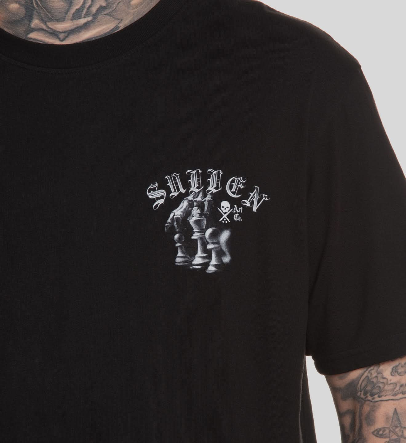 Black t-shirt with white graphic design on a plain background