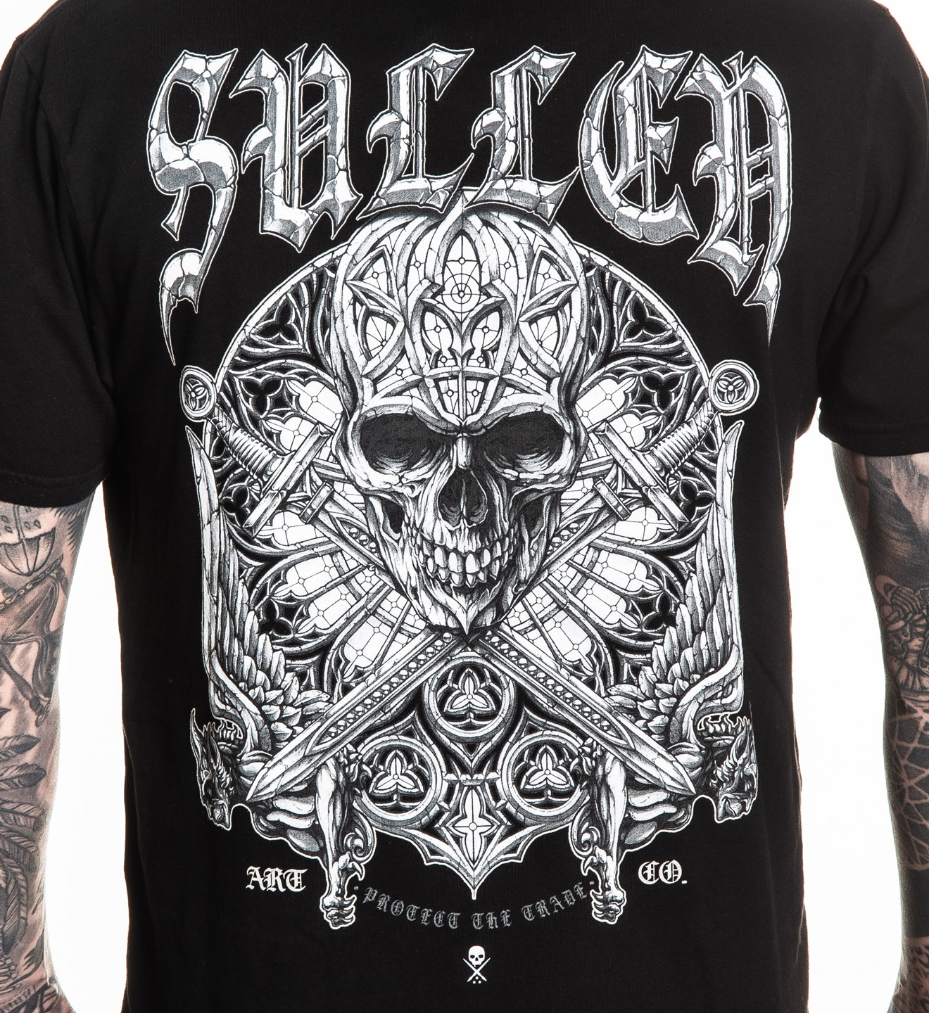 Black t-shirt with intricate white skull design and 'Sullen' branding.