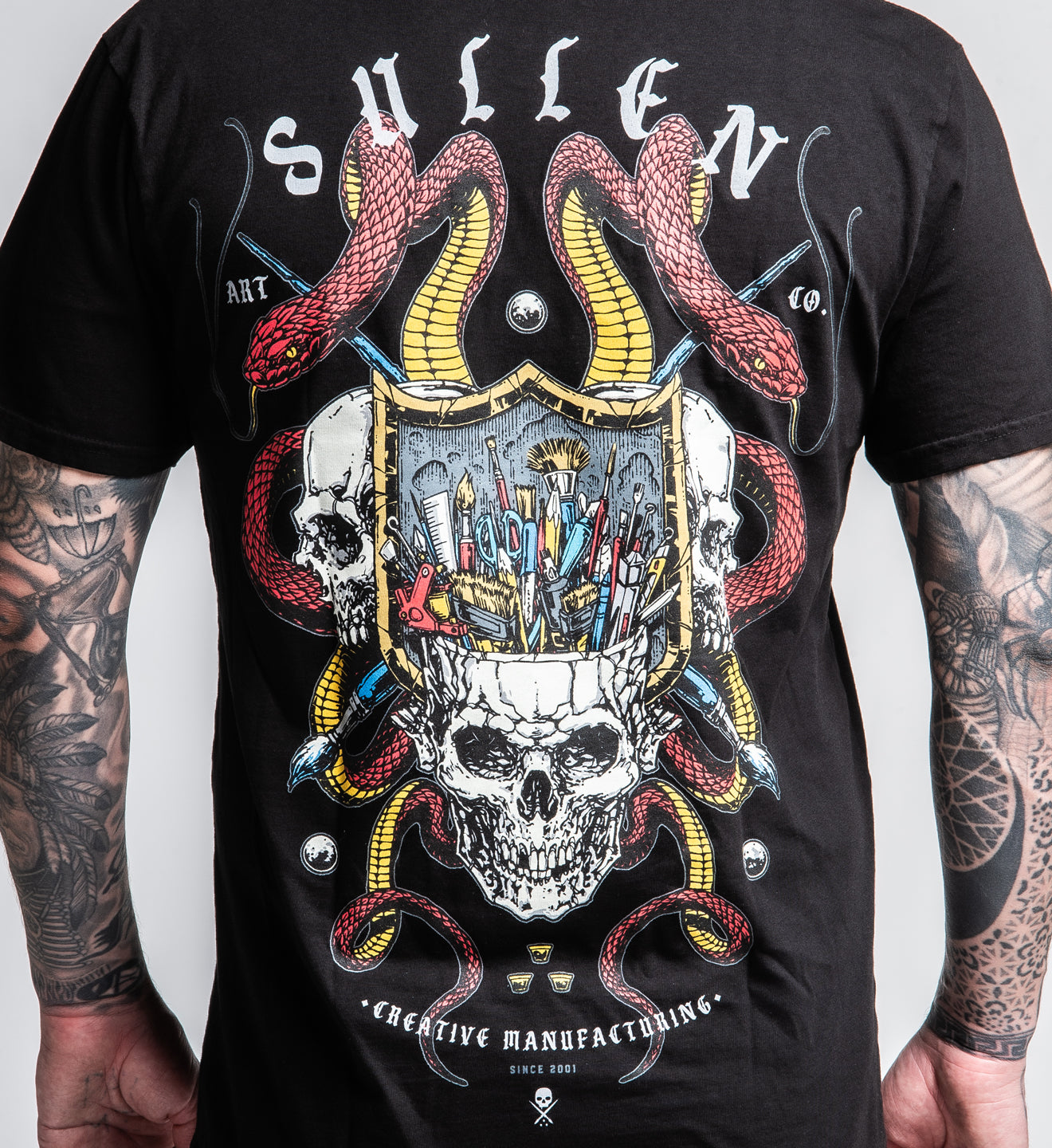 Black t-shirt with a skull and snake design on the back, featuring the brand 'Sullen'.