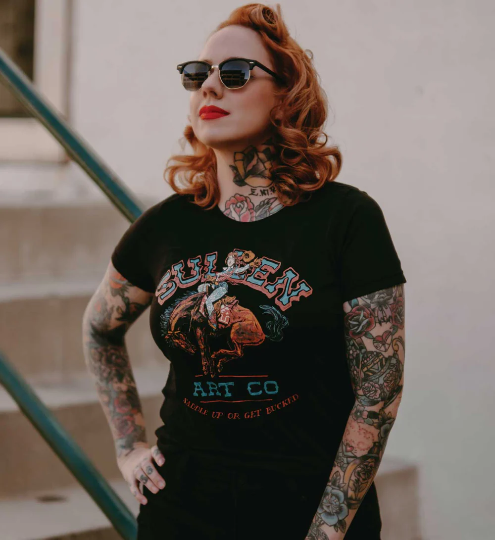 Tattooed woman wearing Sullen clothing