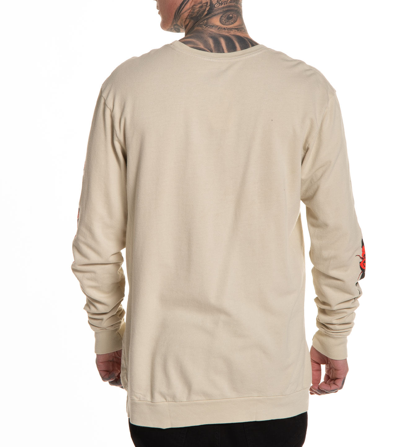 Beige long-sleeve shirt worn by a person on a white background