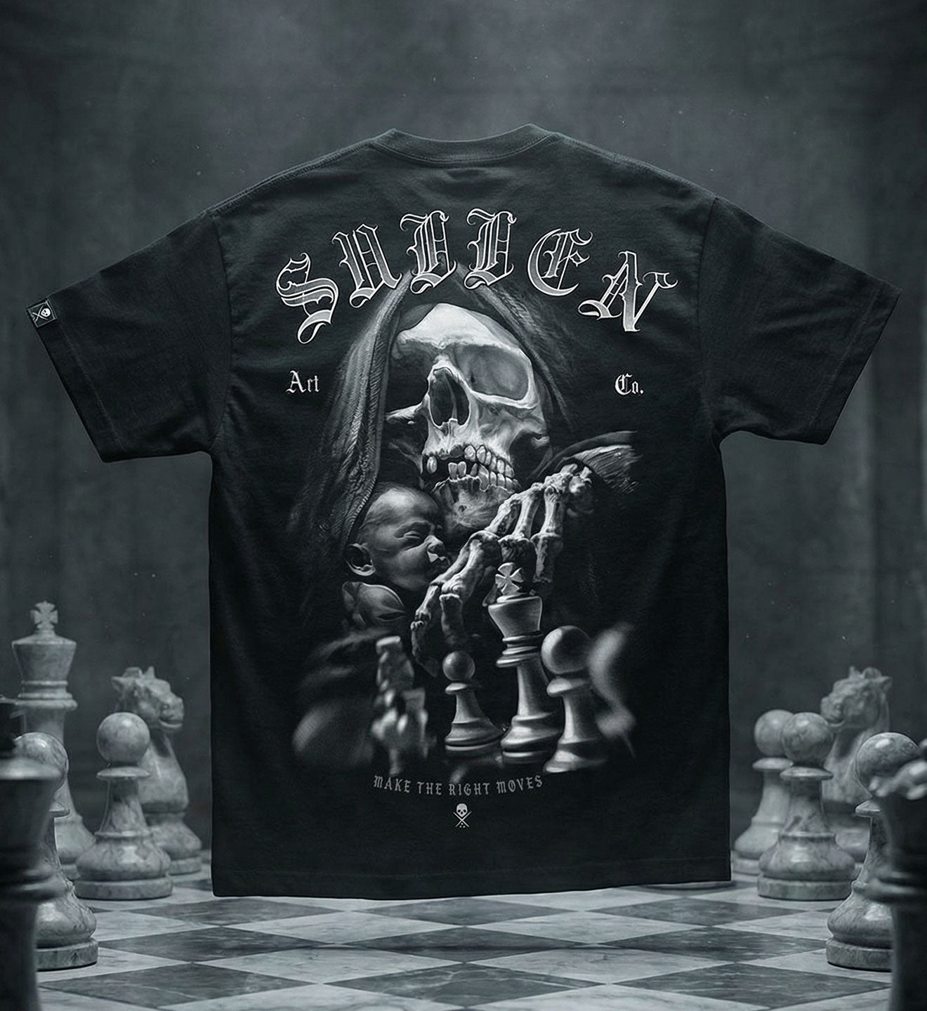 Black t-shirt with a graphic design of a skull and chess pieces on a checkered floor background.