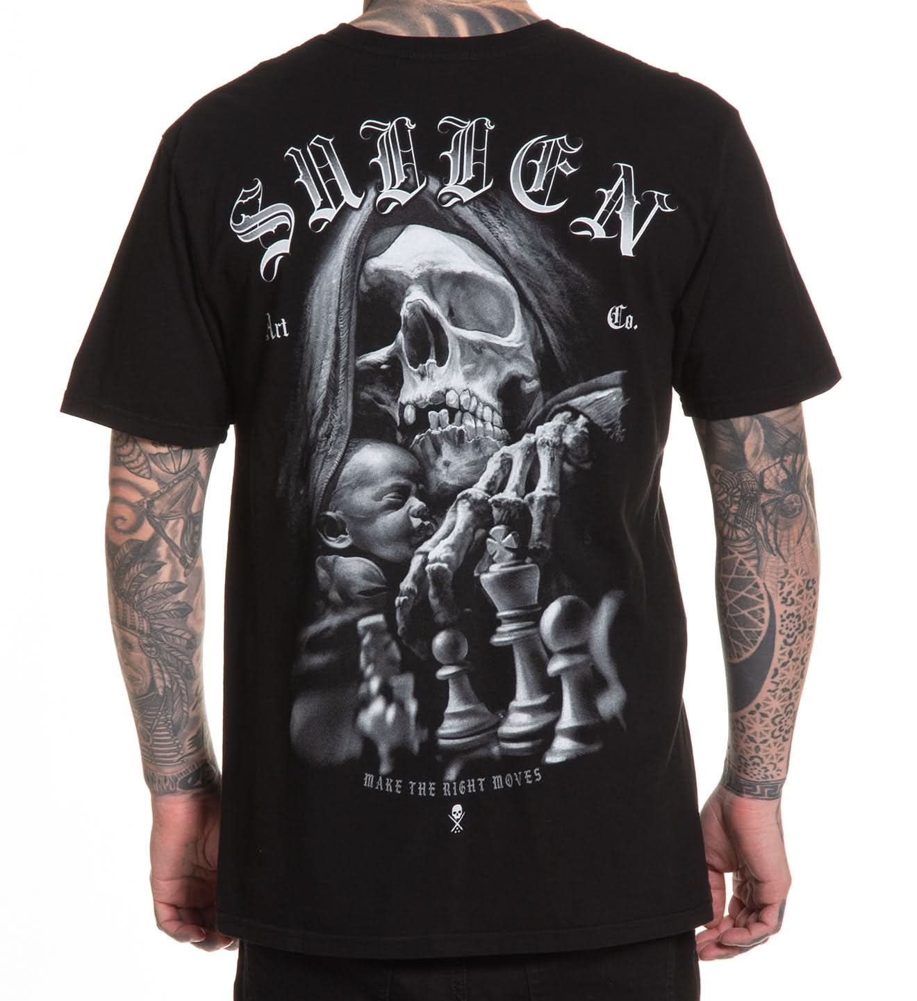 Black t-shirt with a graphic design featuring a skull and chess pieces, worn by a person with tattoos.