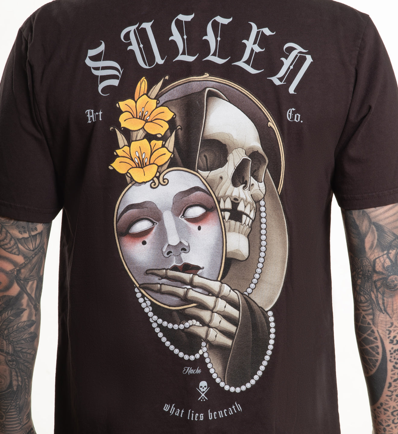 Black t-shirt with a graphic design of a skull and face, featuring the brand 'Sullen'.