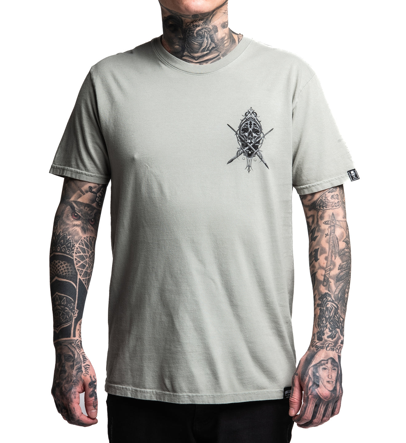 Person wearing a gray t-shirt with a graphic design on a white background